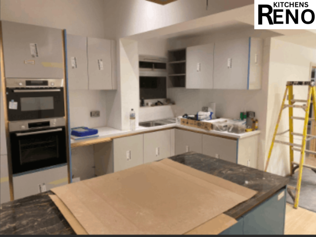 Modern kitchen renovation in progress with fitted cabinets and built-in oven during kitchen renovation & remodel services in Liverpool.
